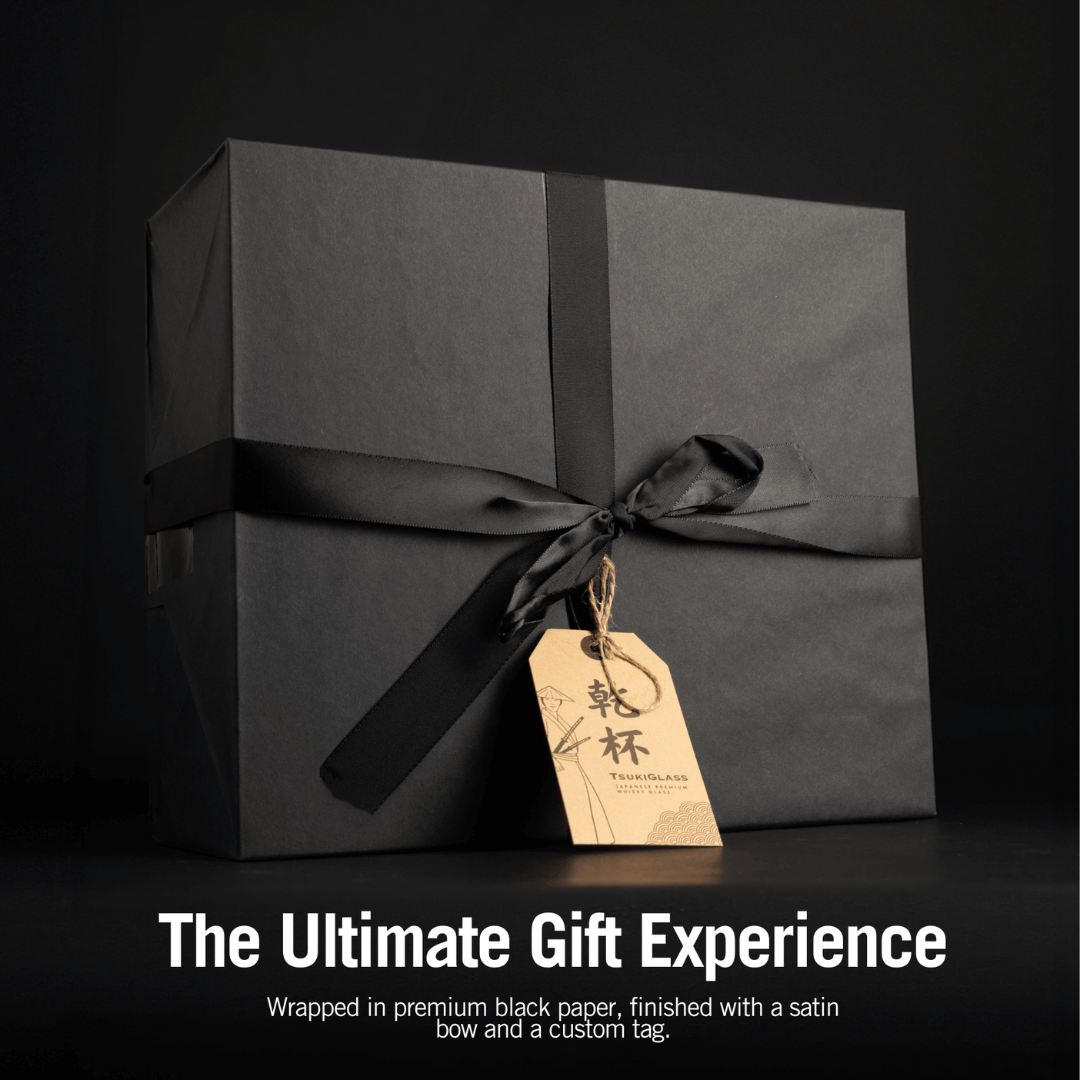 a beautifully wrapped black gift box with a satin ribbon