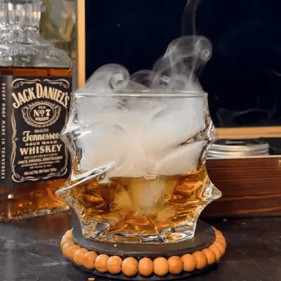 Smoke swirling inside a Storm glass of whisky
