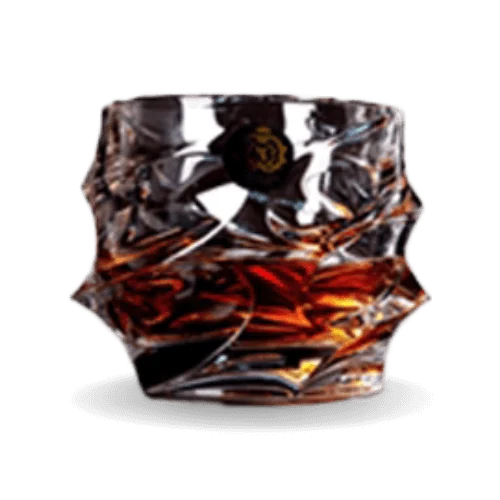 A faceted glass filled with amber liquid.