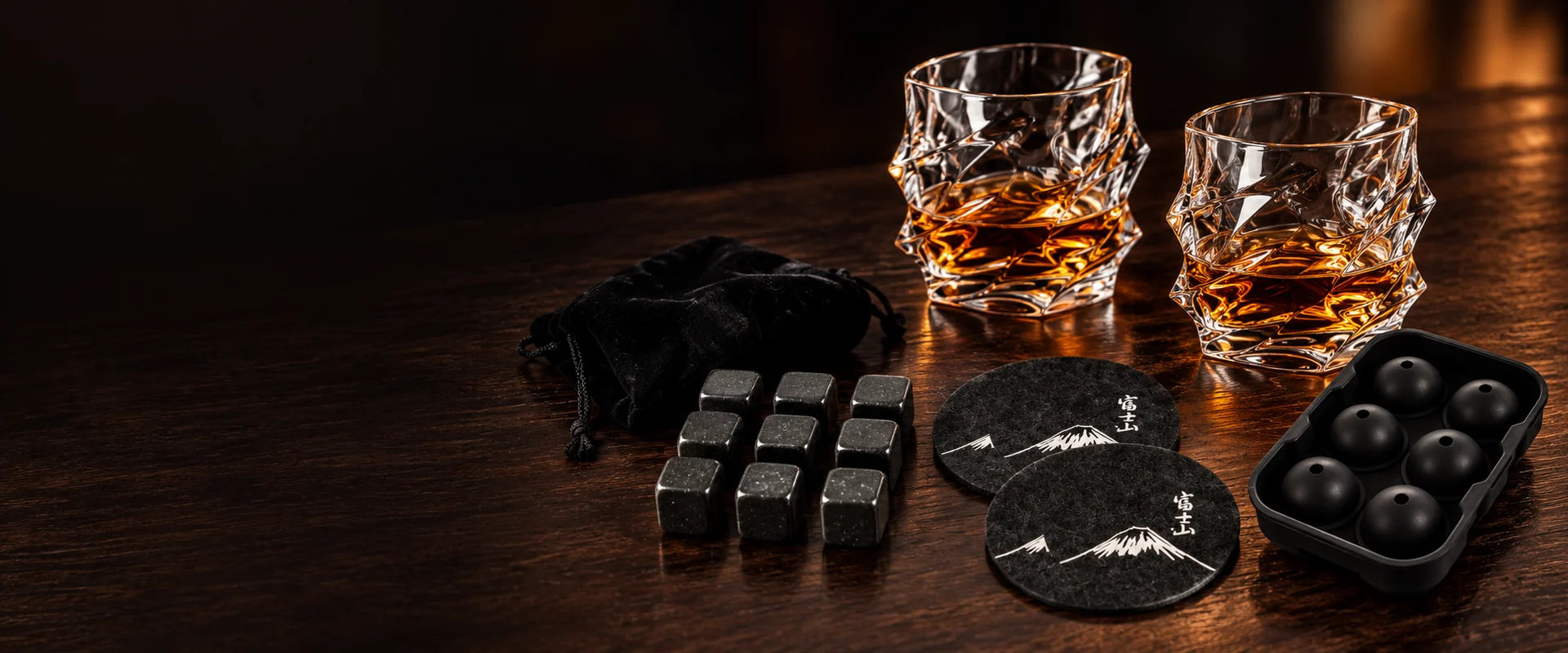 Two Storm glasses with matching whisky accessories
