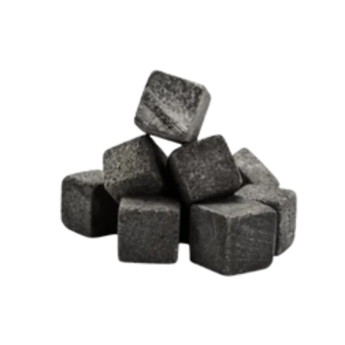 A pile of gray whiskey stones stacked in a pyramid shape.